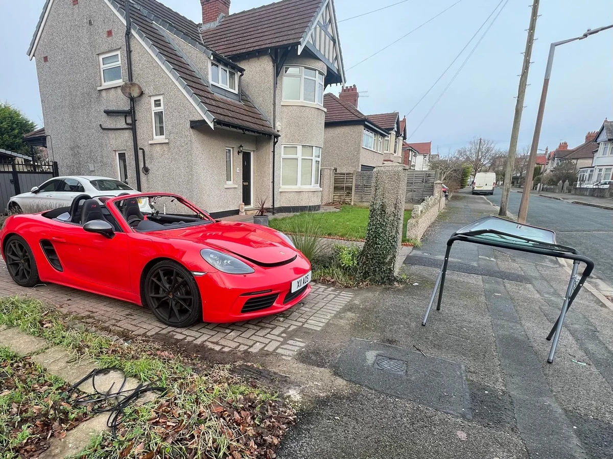 Porsche windscreen replacement on a driveway